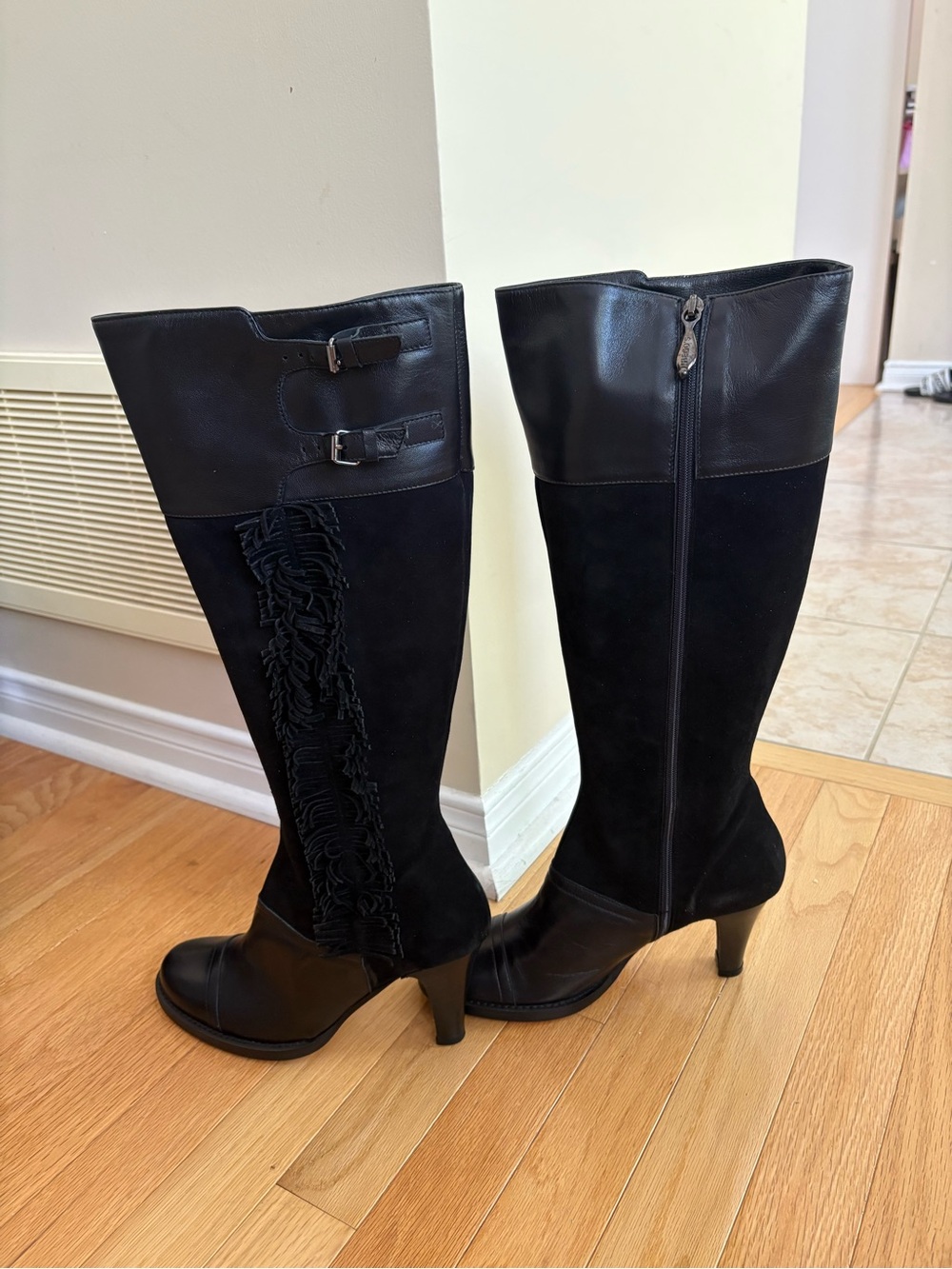 Vero Cuoio Black Knee-High Heeled Boots with Fringe and Buckle Detail